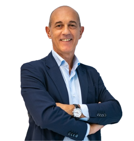 Fabrizio A A smiling man in a blue suit with a light blue shirt stands with arms crossed, wearing a wristwatch and looking confidently at the camera. The background is transparent.